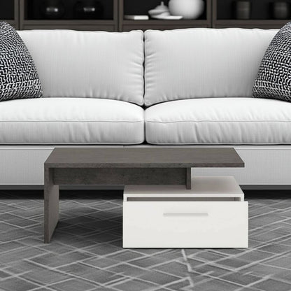 White sofa with a black and white coffee table on a tiled floor