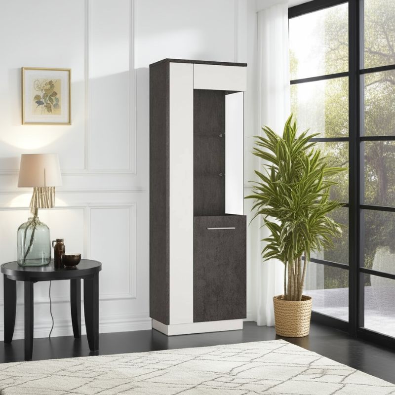 Tall white and black display cabinet in a room with a lamp, plant, and window.